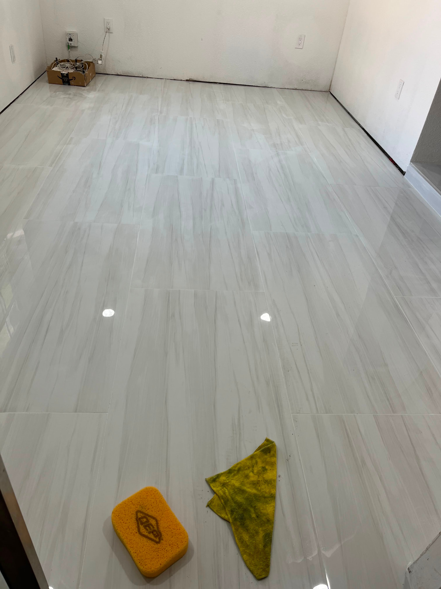 Polished marble-look large-format tile finished and cleaned