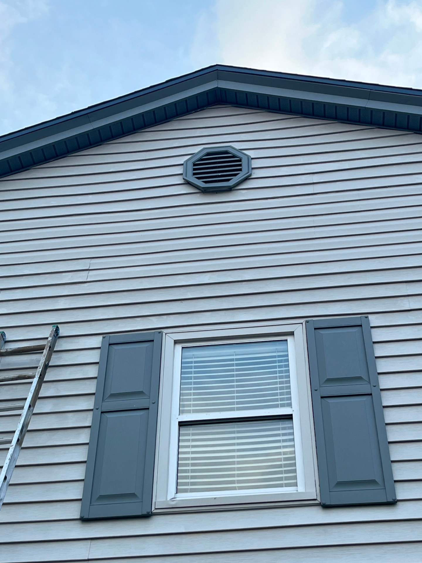 Finished siding, trim and shutters after exterior work